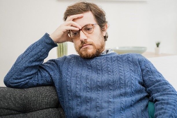 Depressed man sitting alone, sadness