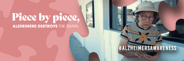 Piece by piece, Alzheimer's destroys the brain, older woman leaning against wall, looking at phone, AD research