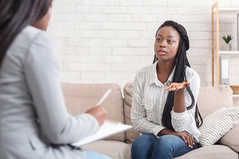 Woman speaking with therapist